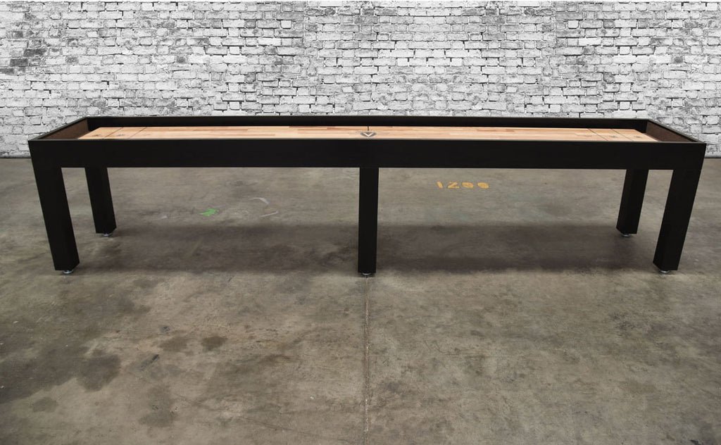 Venture Buckhead Sport 12' Shuffleboard Table with black frame, shown on concrete floor.
