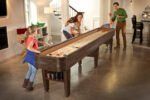 Brunswick Billiards Concord 12' Shuffleboard Table in Nutmeg - Image 6