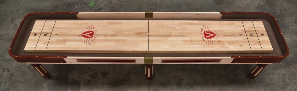 Venture Grand Deluxe 9' Shuffleboard Table with smooth surface and classic markings, top view.