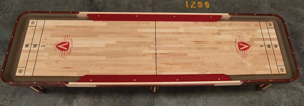 Overhead view of the Venture Grand Deluxe Cushion 12' Shuffleboard Table with red markings.